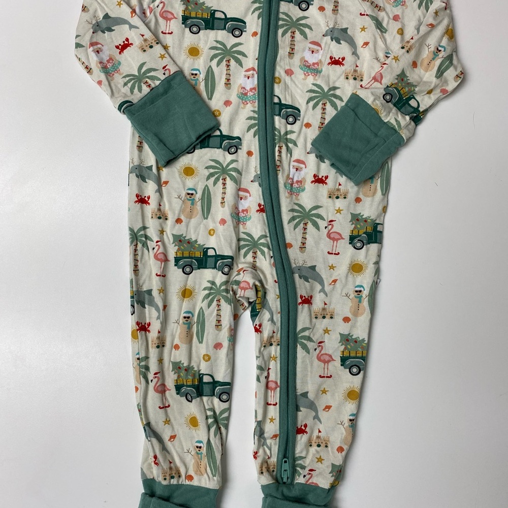 Green and cream One Piece with Santa at the beach.